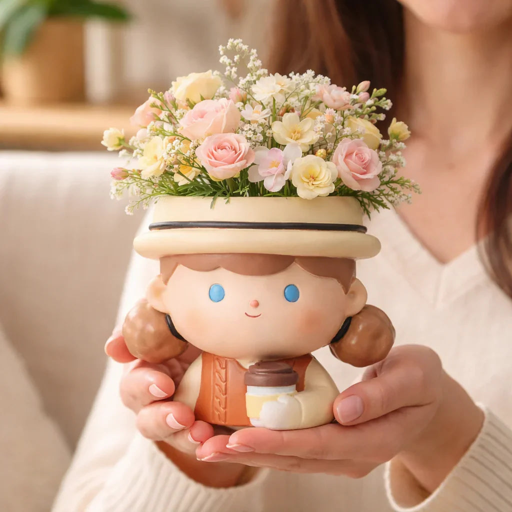 Cute girl ceramic flower pot with pink and yellow flowers, held in hands, Germiant decor