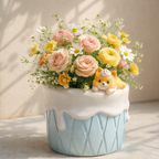 Floral arrangement in a cupcake-shaped vase with a small dog figurine on a neutral background
