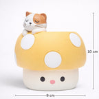 Cute yellow mushroom figurine with white spots, topped with a sleeping cat; 9x10 cm, Germiant.