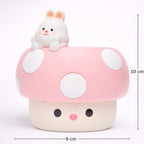 Cute cartoon-style pink mushroom with a small white rabbit on top, featuring measurements on a white background.