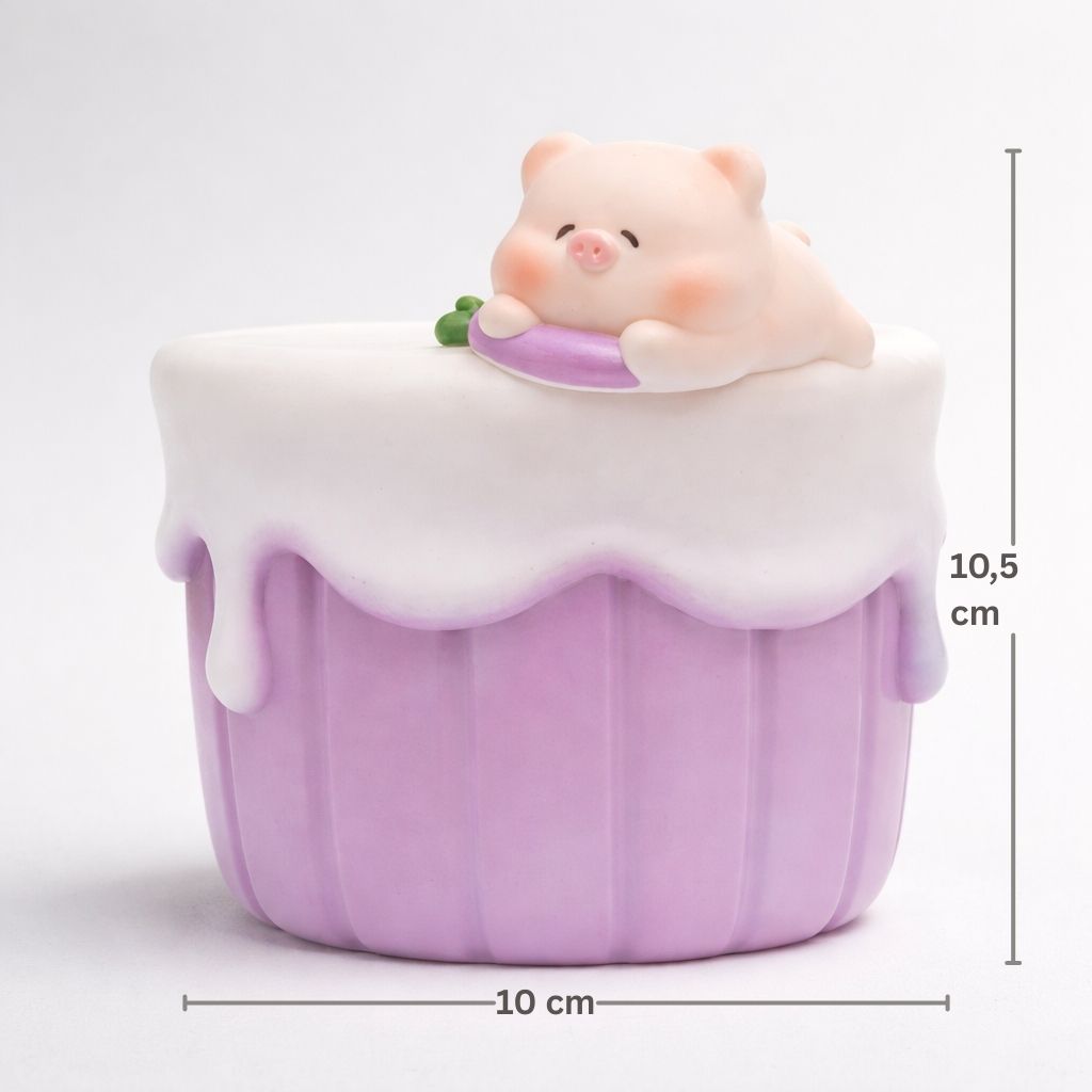 Cute cartoon cat figurine inside a purple cupcake with white frosting on a light gray background.