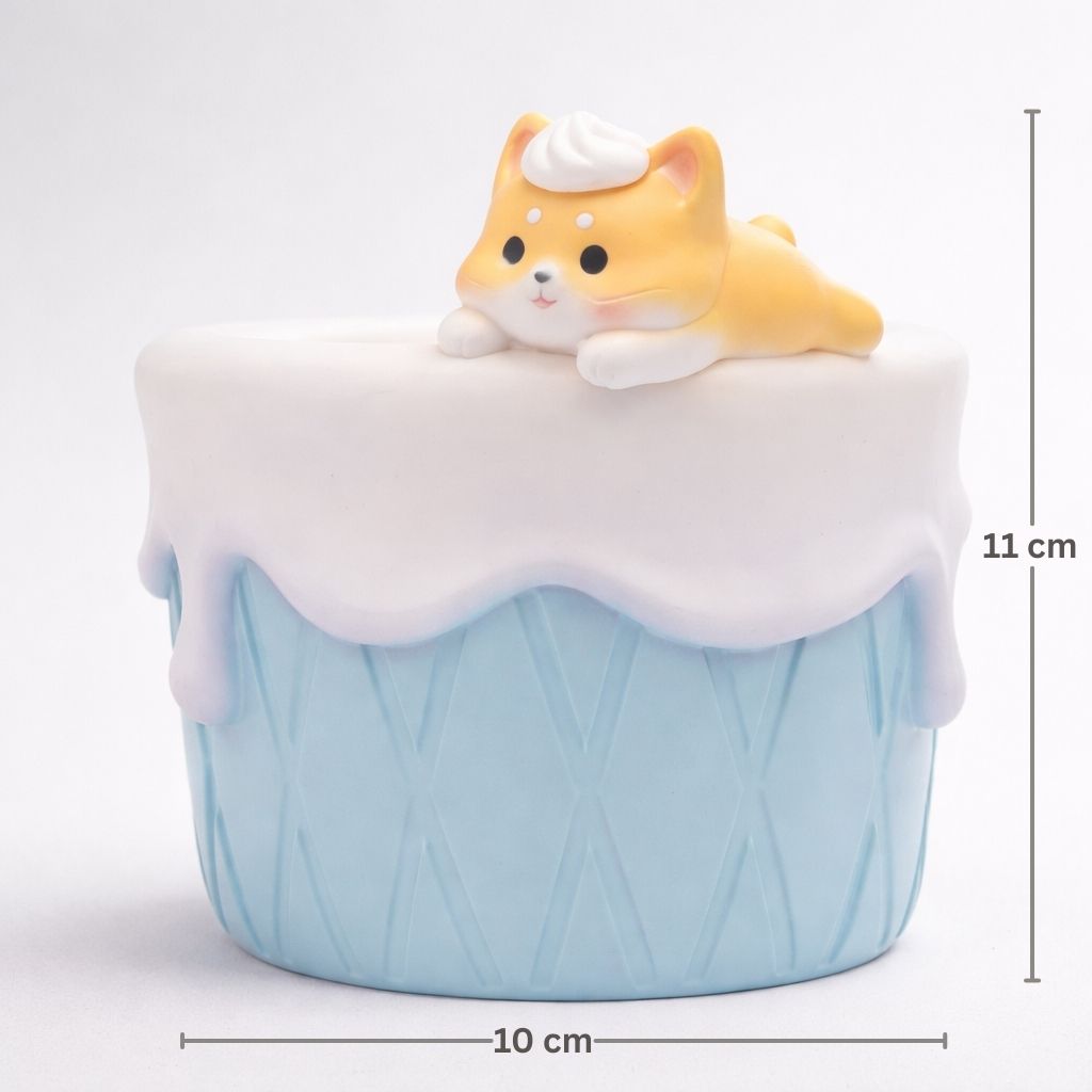 Cupcake-shaped container with a dog figurine on top, featuring measurements on a white background.