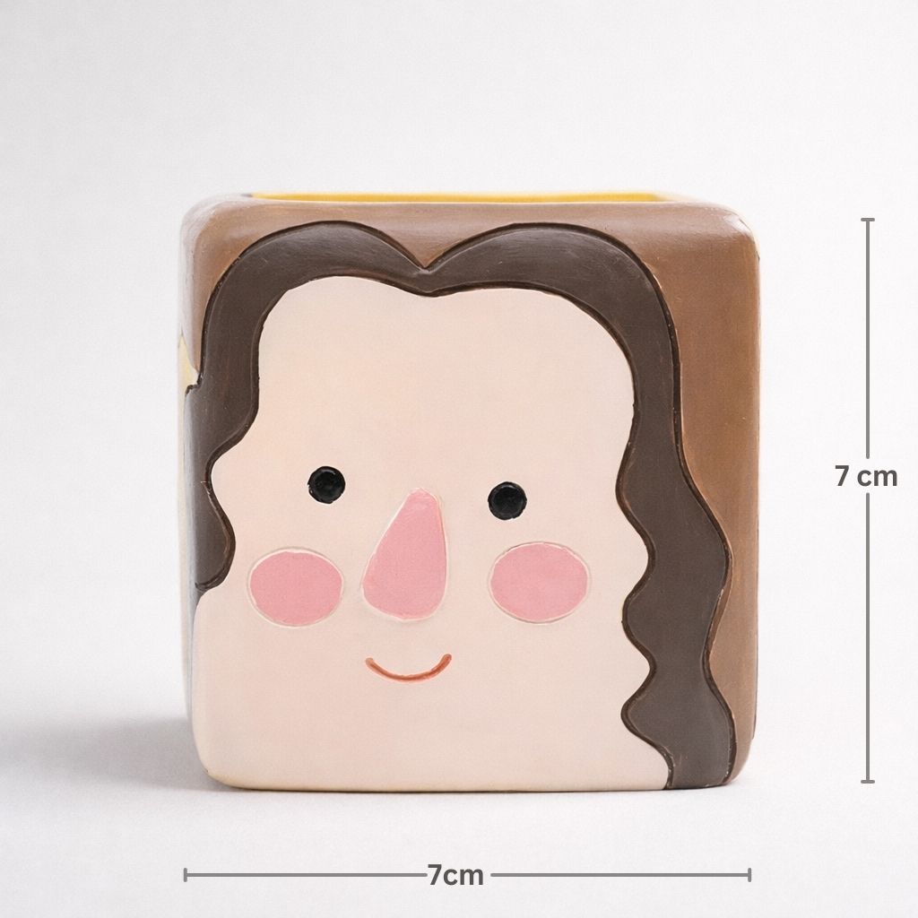 Square block with a face design and dimensions indicated on a white background