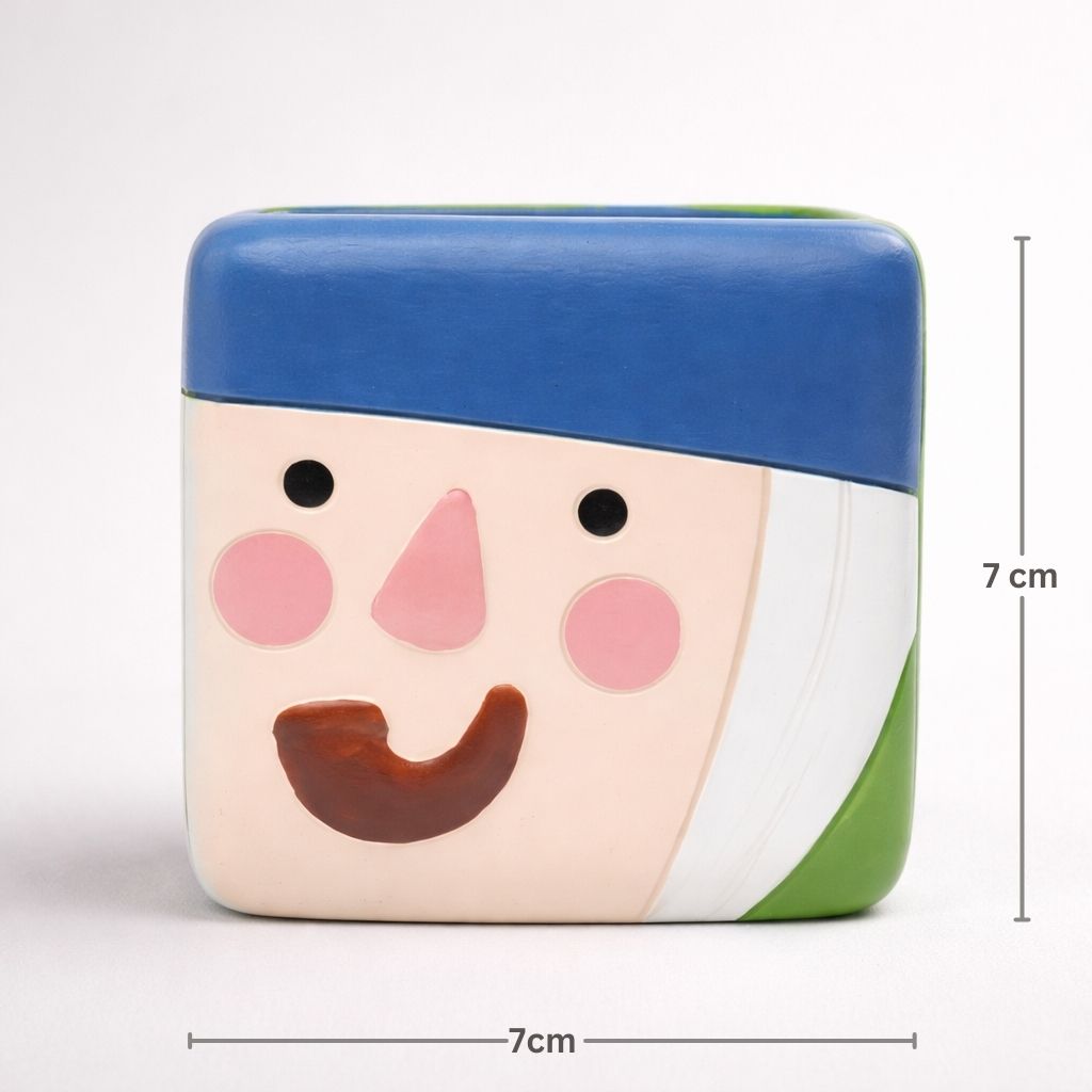 Small square pouch with a face design and measurements on a white background