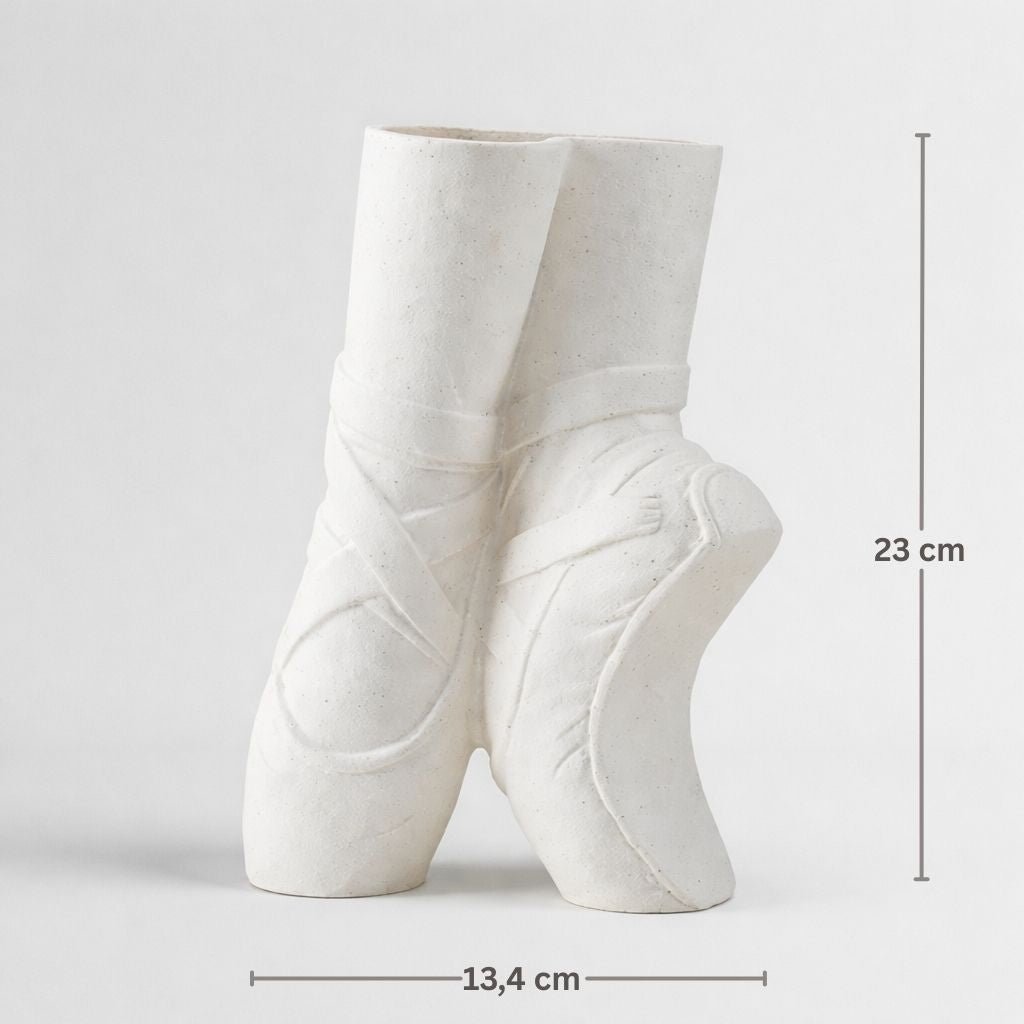 White ceramic ballet shoes with measurements on a light gray background