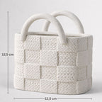 White textured handbag with dimensions on a light gray background
