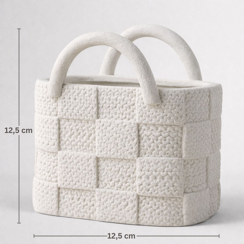 White textured handbag with dimensions on a light gray background