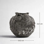 Artisan black ceramic vase with textured landscape design, 14.5 cm wide, 13.5 cm tall