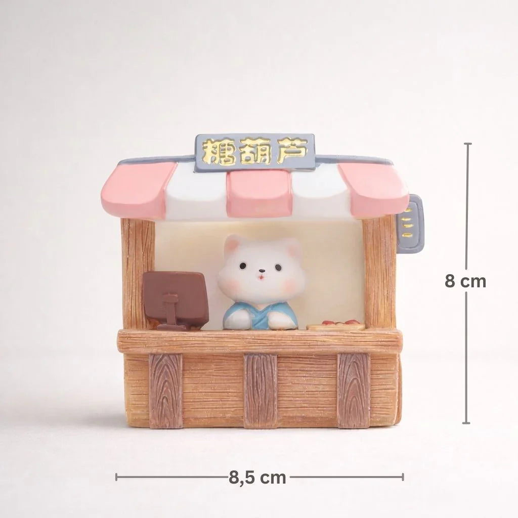 Miniature bear figurine in a candy shop stall with pink awning, 8x8.5 cm, Germiant