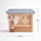 Cute bunny figurine in a miniature tea shop with tiled roof, 7x8.5 cm, Germiant decor