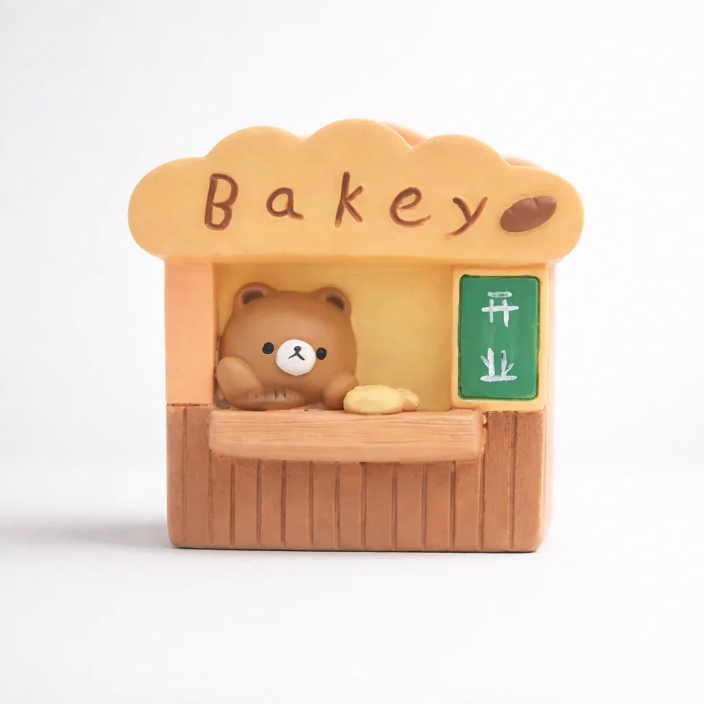 Cute bear figurine at bakery stall with bread, Germiant store decor