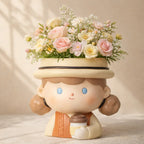 Cute girl-shaped ceramic flower pot with pastel pink and yellow flowers, Germiant decor