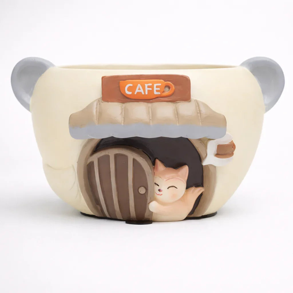 Cute bear-shaped ceramic mug with a cat at a cafe door, novelty drinkware from Germiant