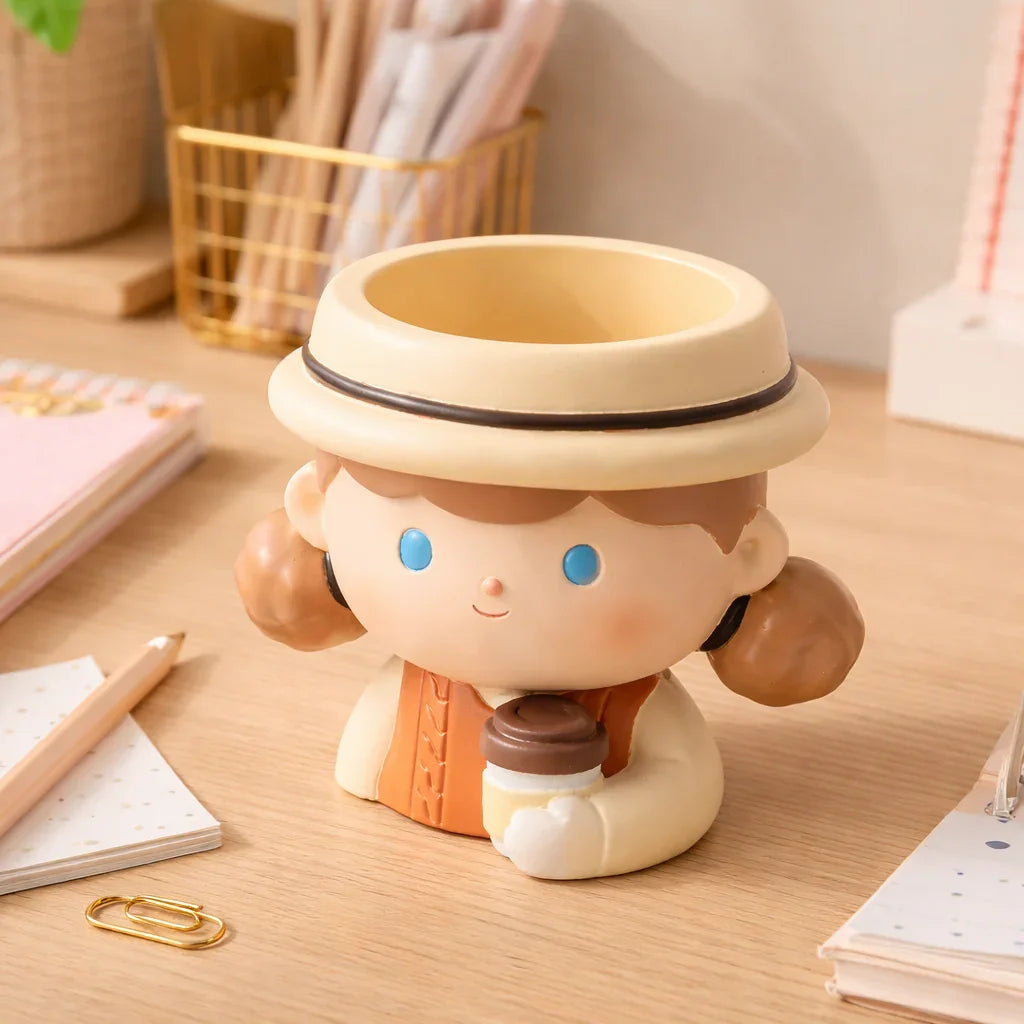 Cute ceramic planter shaped like a girl holding coffee on a tidy desk, Germiant decor