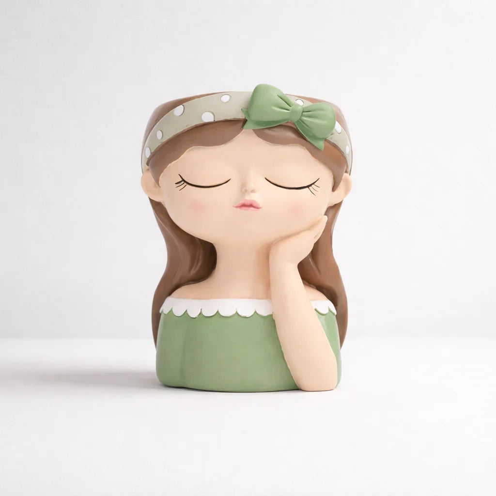 Green decorative girl figurine with bow and headband, Germiant home decor.