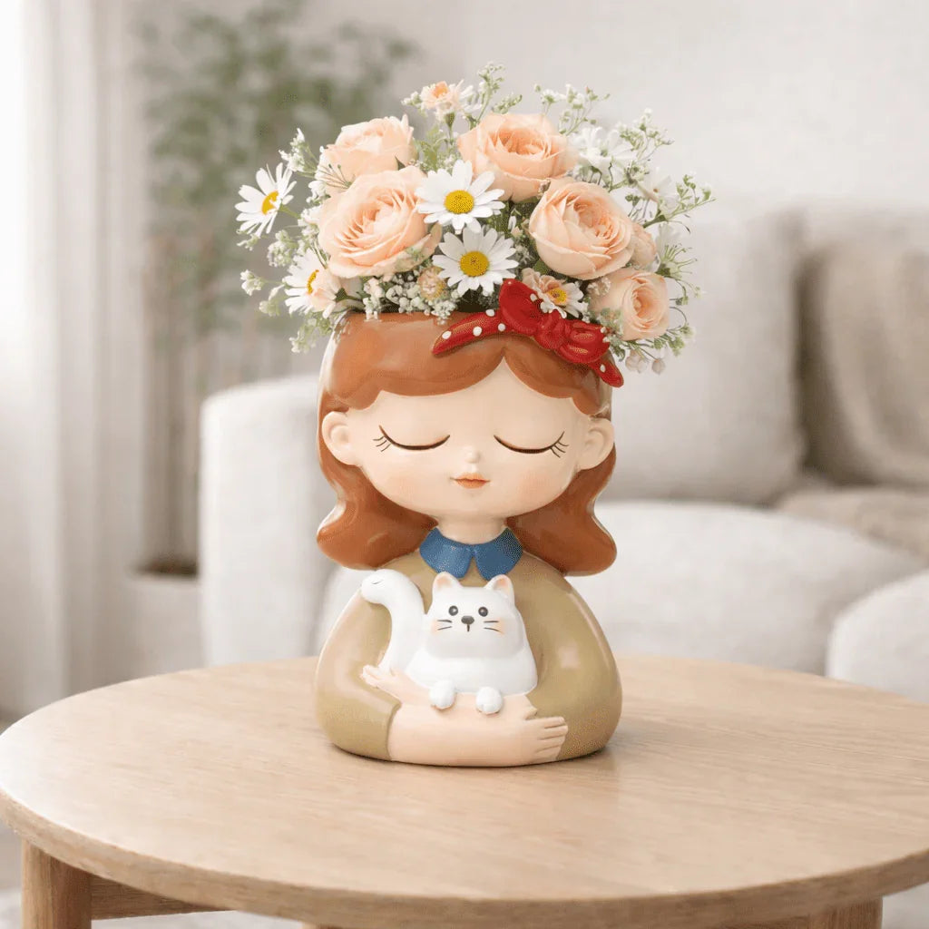 Decorative figurine of a girl with flowers on her head, holding a cat, on a wooden table.