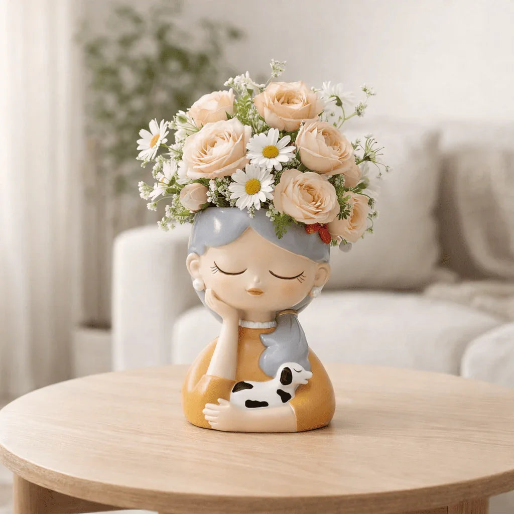 Decorative figurine with floral arrangement on a wooden table