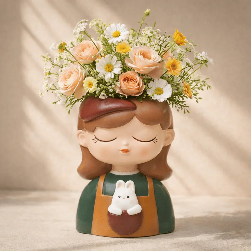 Decorative vase shaped like a girl with flowers on her head against a beige background