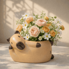 Floral arrangement in a capybara shaped pot on a neutral background