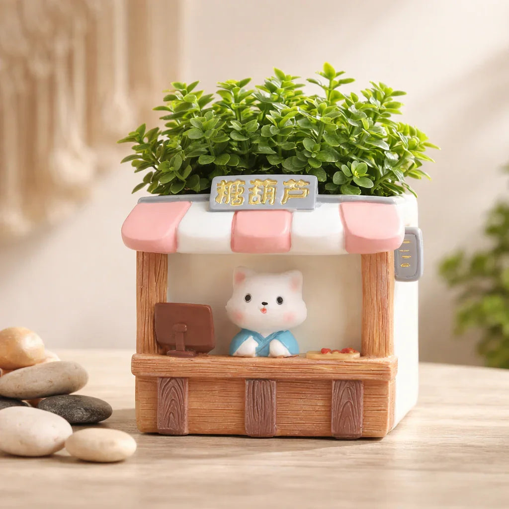 Cute cat figurine planter with artificial greenery in a market stall design, Germiant decor