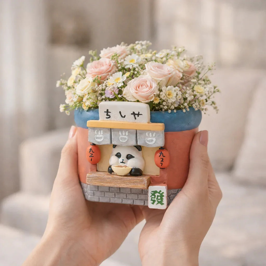 Cute panda flower pot with pink roses and daisies, held in hands, Germiant homepage image