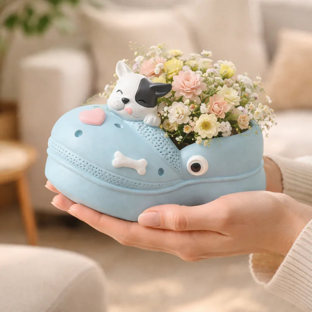 Cute dog-themed blue shoe planter with flowers, held in hands, Germiant home decor