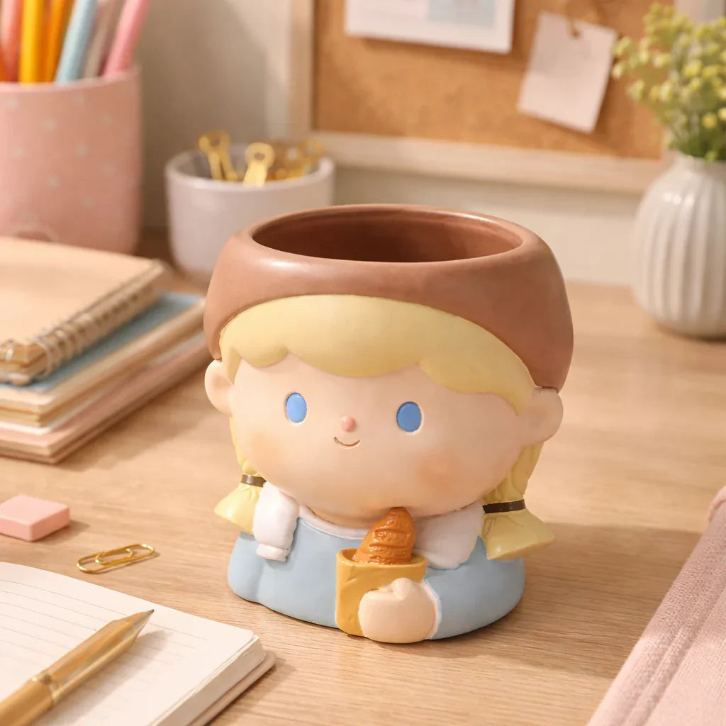 Cute girl ceramic pen holder on wooden desk, stationery and flowers, Germiant decor