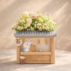 Cute bunny tea shop planter with pastel flowers, floral decor from Germiant