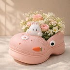 Cute pink shoe planter with bunny figurine, pastel flowers, and decorative carrot, Germiant decor